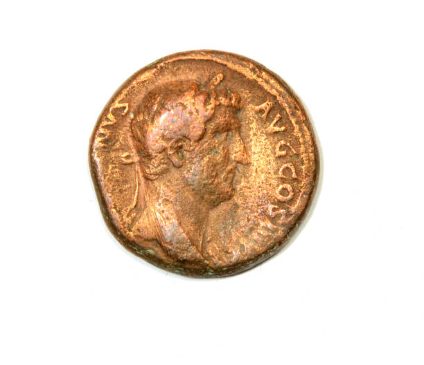 istock Ancient Roman coin on a white background. Emperor Hadrian. Front 1289237811
