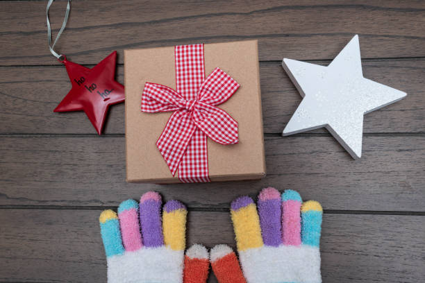 istock Colorful gloves and christmas present 1289238393