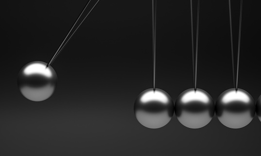 3d render of a gray metal newton pendulum cradle on a black background. time and business concept. nobody around.