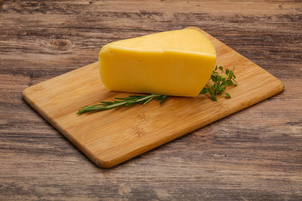 istock Hard cheese piece served rosemary 1289239889