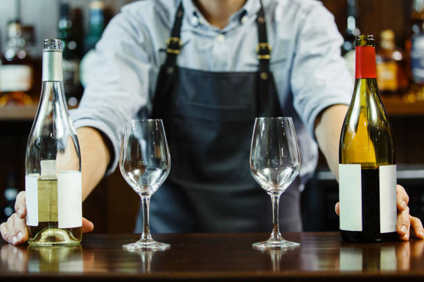 istock male sommeliers holds white and red wine 1289241335