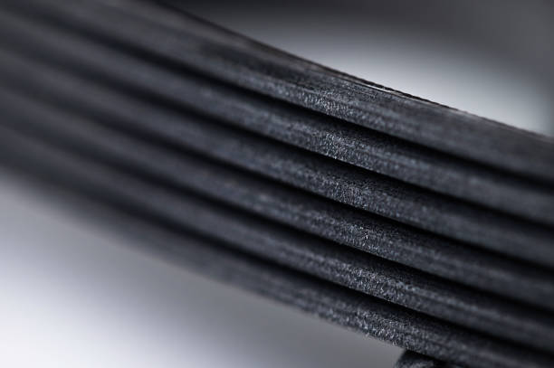 istock New belt for automobile poly-V-belt electricity generator. Macro close-up blank for background 1289247146
