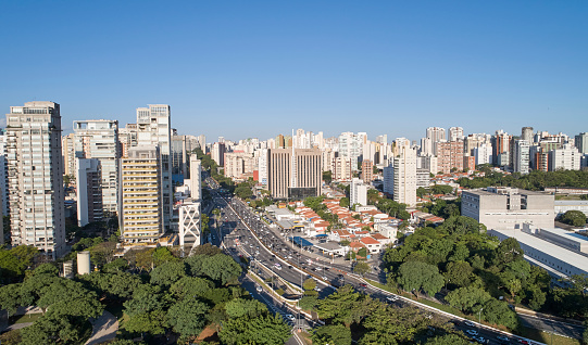 Aerial view of Sao Paulo city, car traffic in Avenida 23 de Maio, north-south corridor, commercial and residential buildings in Sao Paulo city,  Brazil.