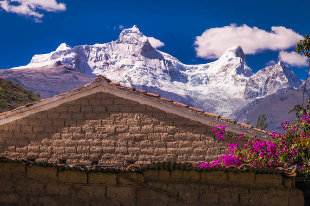Huandoy massif - Cordillera blanca near Huaraz and adobe roof  - Ancash Andes, Peru Huandoy massif - Cordillera blanca near Huaraz and adobe roof  - Ancash Andes, Peru andes photos stock pictures, royalty-free photos & images