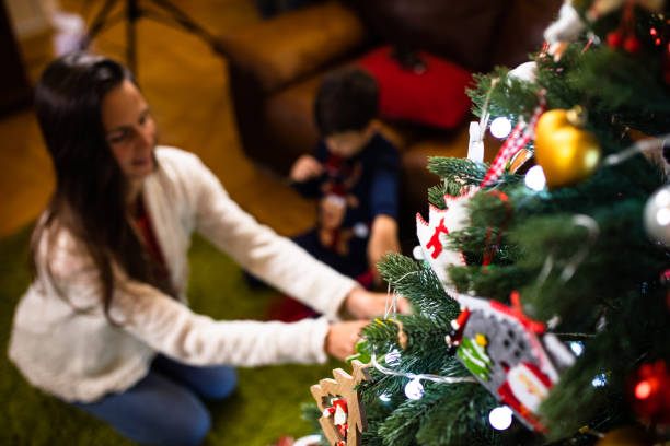istock Mother and son decorating the Christmas tree 1289253863