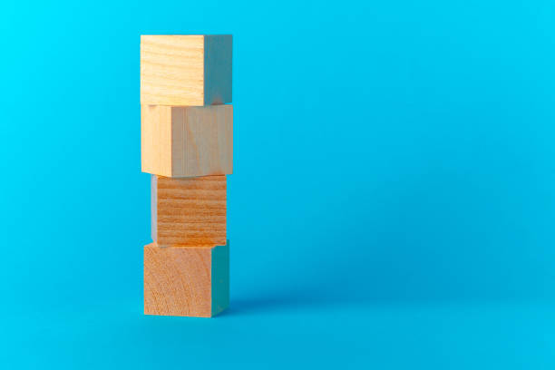istock Toy wooden blocks on blue background front view 1289255004