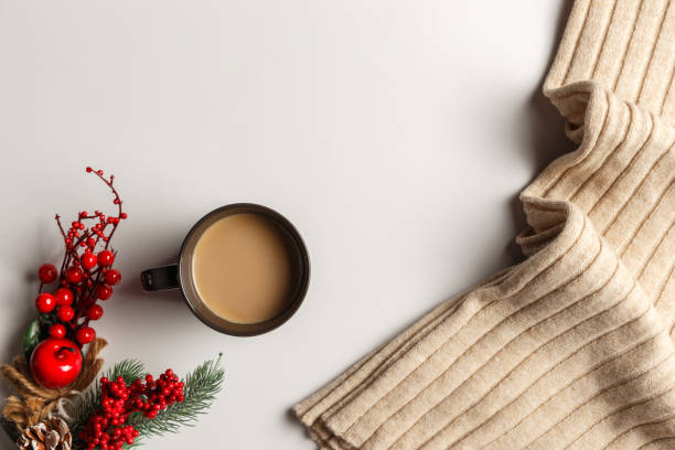 istock Abstract autumn composition. Colorful background image. Autumn, winter concept. Top view. Flat lay. Copy space. Plaid, dried leaves, cup of coffee on white background. Thanksgiving day concept 1289255443