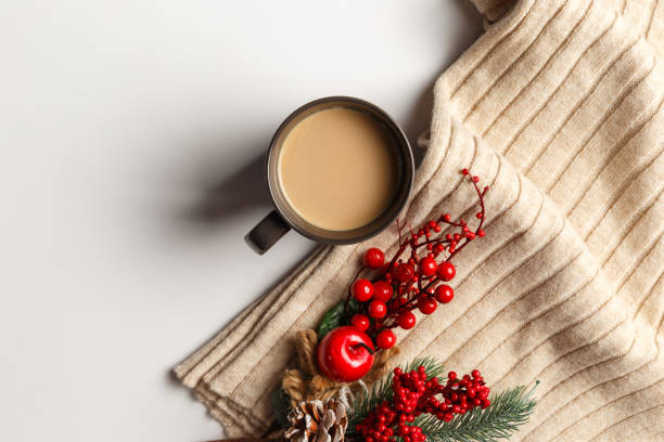 istock Abstract autumn composition. Colorful background image. Autumn, winter concept. Top view. Flat lay. Copy space. Plaid, dried leaves, cup of coffee on white background. Thanksgiving day concept 1289255505