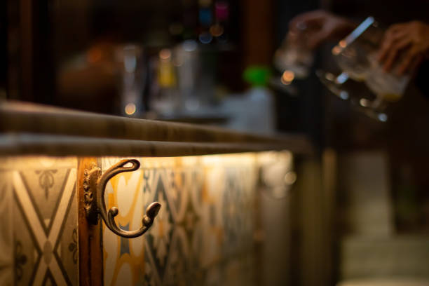 Hook to hang coats on a bar counter.