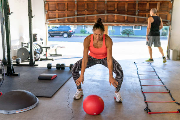 istock Athletic couple exercising together at home 1289259474