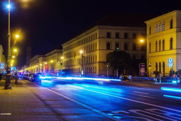 istock Ludwigstrasse at night with traffic as seen from Odeonsplatz, Munich, Germany 1289264618
