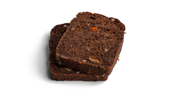 istock Black, rye bread with dried fruit on a white background 1289265036