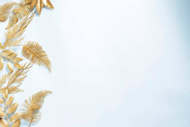 istock Festive christmas background with gold leaves 1289265923