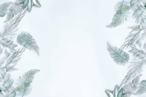 istock Festive christmas background with silver leaves 1289266104