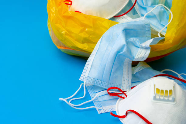 istock Protective equipment, masks and gloves, on blue background 1289269168