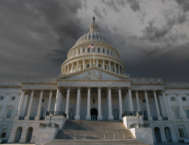 US Capitol with Thunderstorm Sky United States Capitol Building in Washington DC with dark thunderstorm sky. capitol building washington dc photos stock pictures, royalty-free photos & images