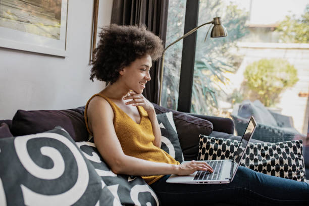 istock African American woman is using laptop at home 1289270257