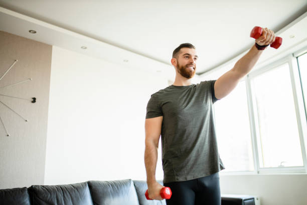 Lift Weights At Home Stock Photos, Pictures & Royalty-Free Images - iStock