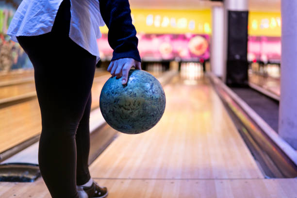 istock Unrecognizable young woman Playing Bowling 1289274814