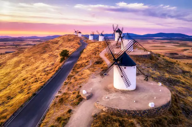 aerial view of traditional medieval spanish windmills in Consuegra at sunset. Castilla La Mancha, Spain