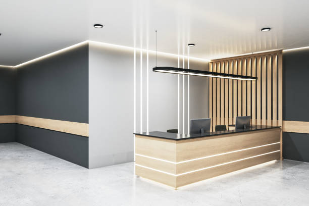 istock Contemporary office lobby with wooden reception desk 1289275530