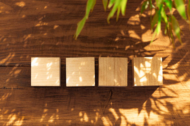 groupped wooden square blocks on dark wooden table - groupped imagens e fotografias de stock