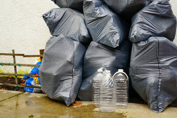istock Empty water bottle in the black bag, Plastic recycle 1289279353