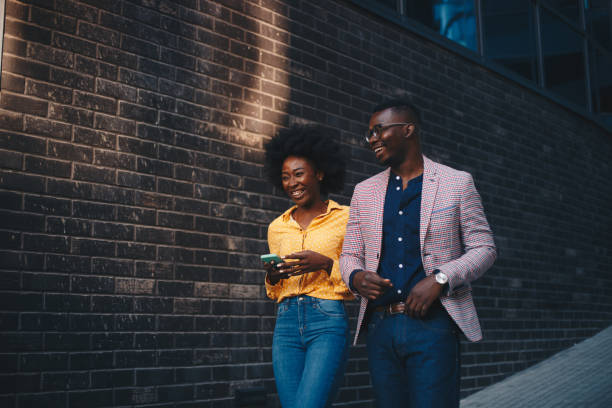 istock Young hipster couple walking, smiling. 1289279432