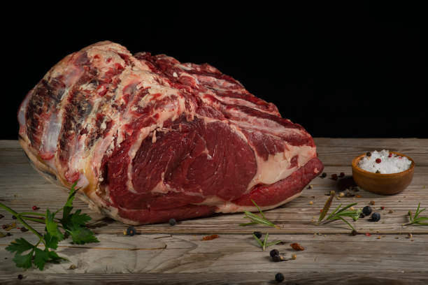 istock beef cutlet on the wooden table with spices 1289280290