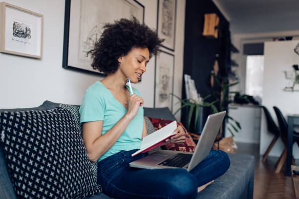 istock Young African American freelancer making plans for her business 1289280503