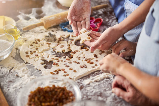 istock Cooks working at table covered with dough and food supplies 1289283721