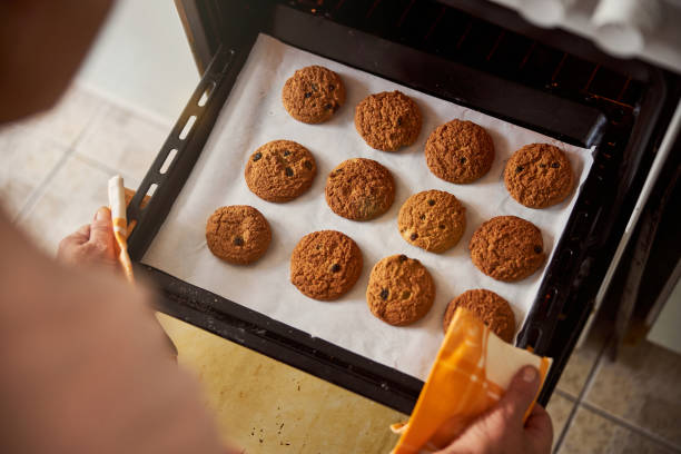 istock Fresh home-baked cookies on a baking sheet 1289283739