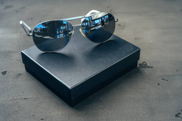 istock New dark aviator glasses on grey concrete background 1289287131