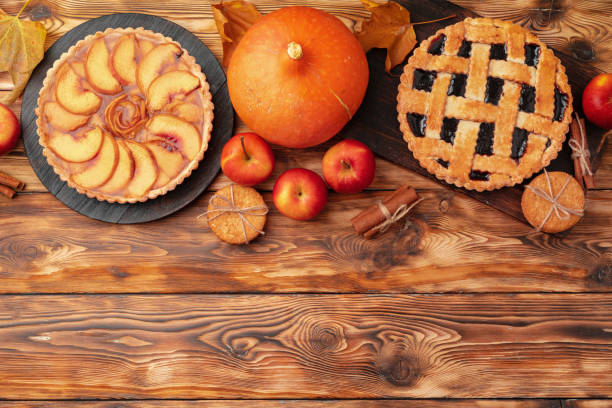 istock Thanksgiving berry and apple various pies on wooden surface, top view 1289287915