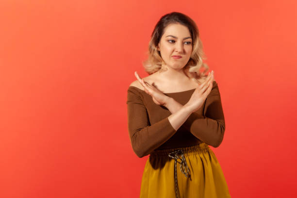 istock Girl crossing hands meaning stop 1289288175
