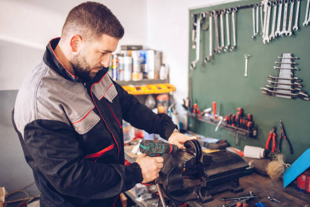 istock The service mechanic works with the tools in the workshop 1289288821