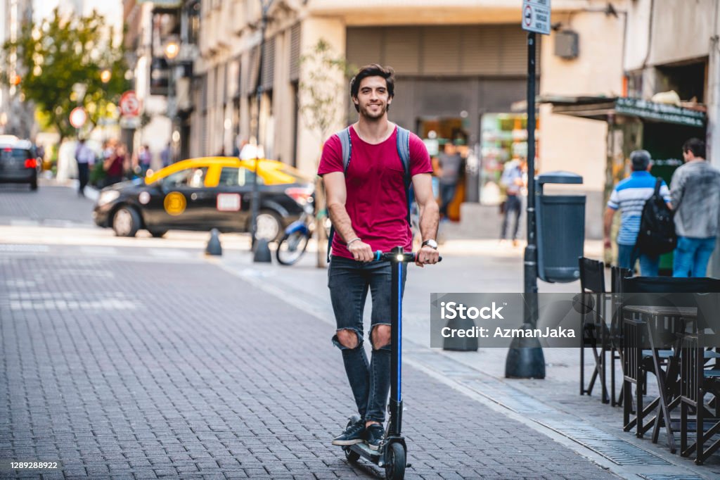 Male Tourist Exploring Buenos Aires On Electric Push Scooter Stock - Download Image Now -