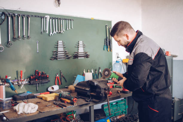 istock The service mechanic works with the tools in the workshop 1289289027