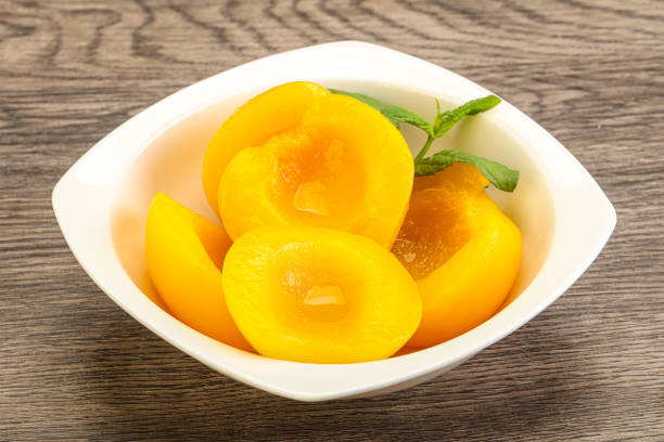 istock Sweet ripe canned peaches with mint 1289291169