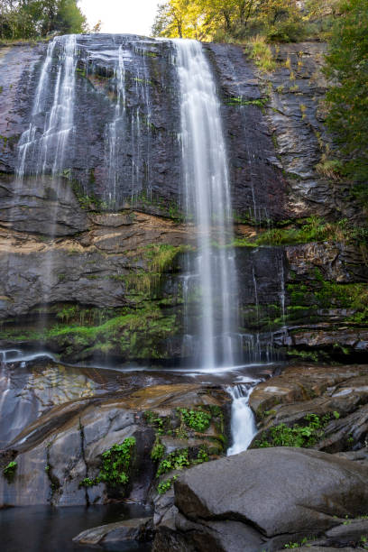istock The waterfall flowing through the rocks in forest 1289292803