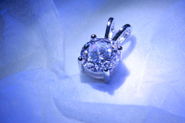 istock Luxury beautiful diamond accessories that shine blue in a dark room 1289293900