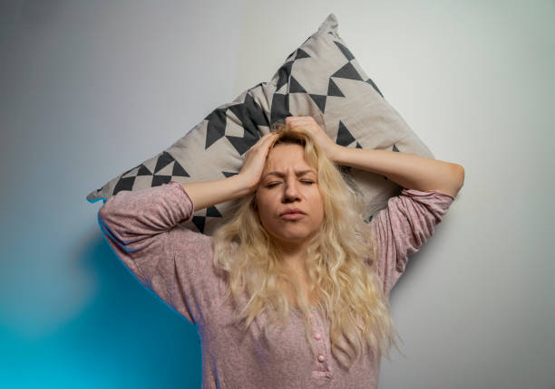 istock Woman laying on the pillow having headache or insomnia 1289296882