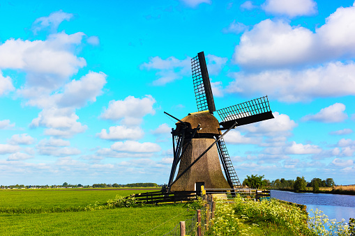 Friesland, Netherlands: Windmill Close-Up, Turquoise Sky, Puffy Clouds.  Shot near Sneek, Friesland.