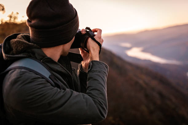 istock Young photographer making photographs of mountain range 1289302772