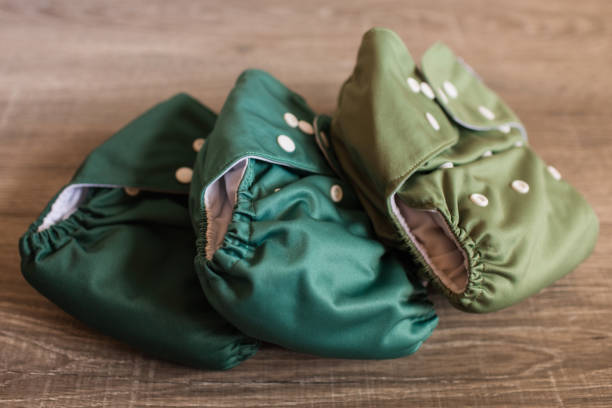 istock A Stack of Green Solid-Colored Reusable Cloth Diapers on a Wooden Floor 1289303443