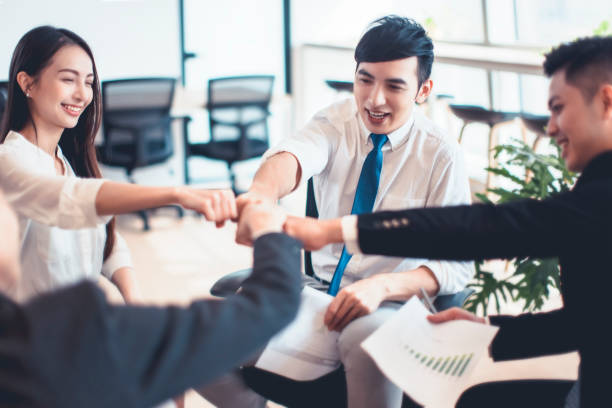 istock successful business team showing unity by hands together 1289305539