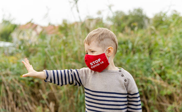 istock Little boy in a protective mask. Prevention against coronavirus 1289306320