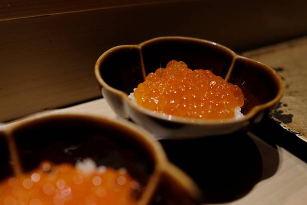 istock Fish roe (ikura) on rice in a Japanese restaurant 1289311195