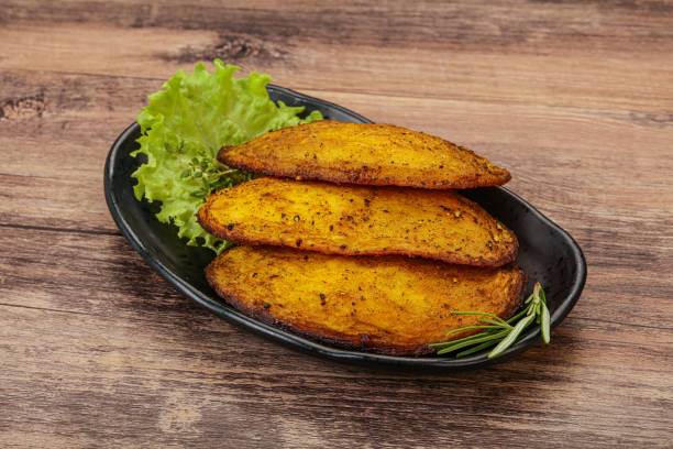 istock Baked potato with herbs and spices 1289315898