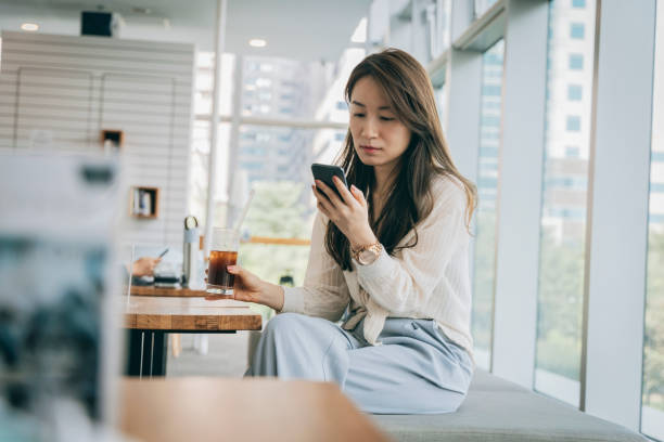 istock Asian woman working in cafe 1289317450
